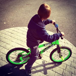 child on bike